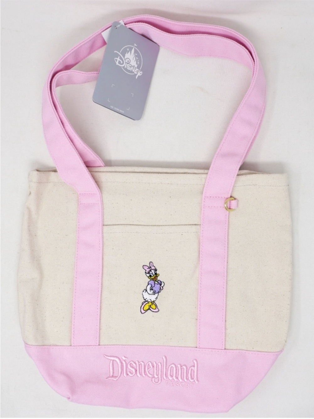 Disney Disneyland Resort Daisy Duck Canvas Tote in Pink and Cream